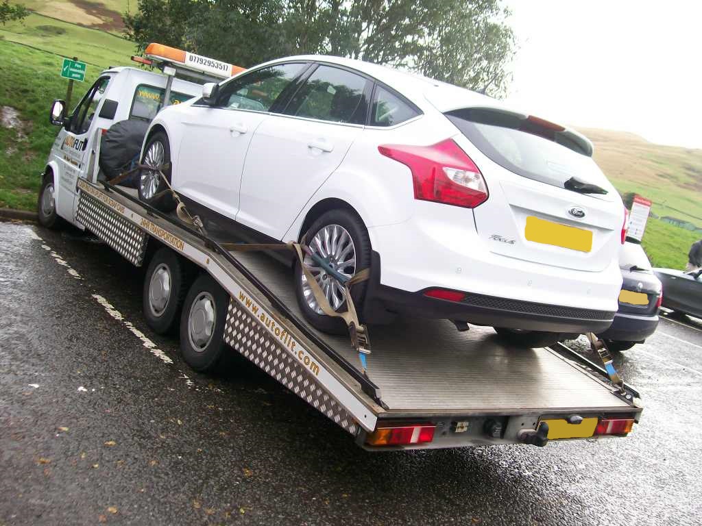Ford Focus on the back of the Autoflit transporter