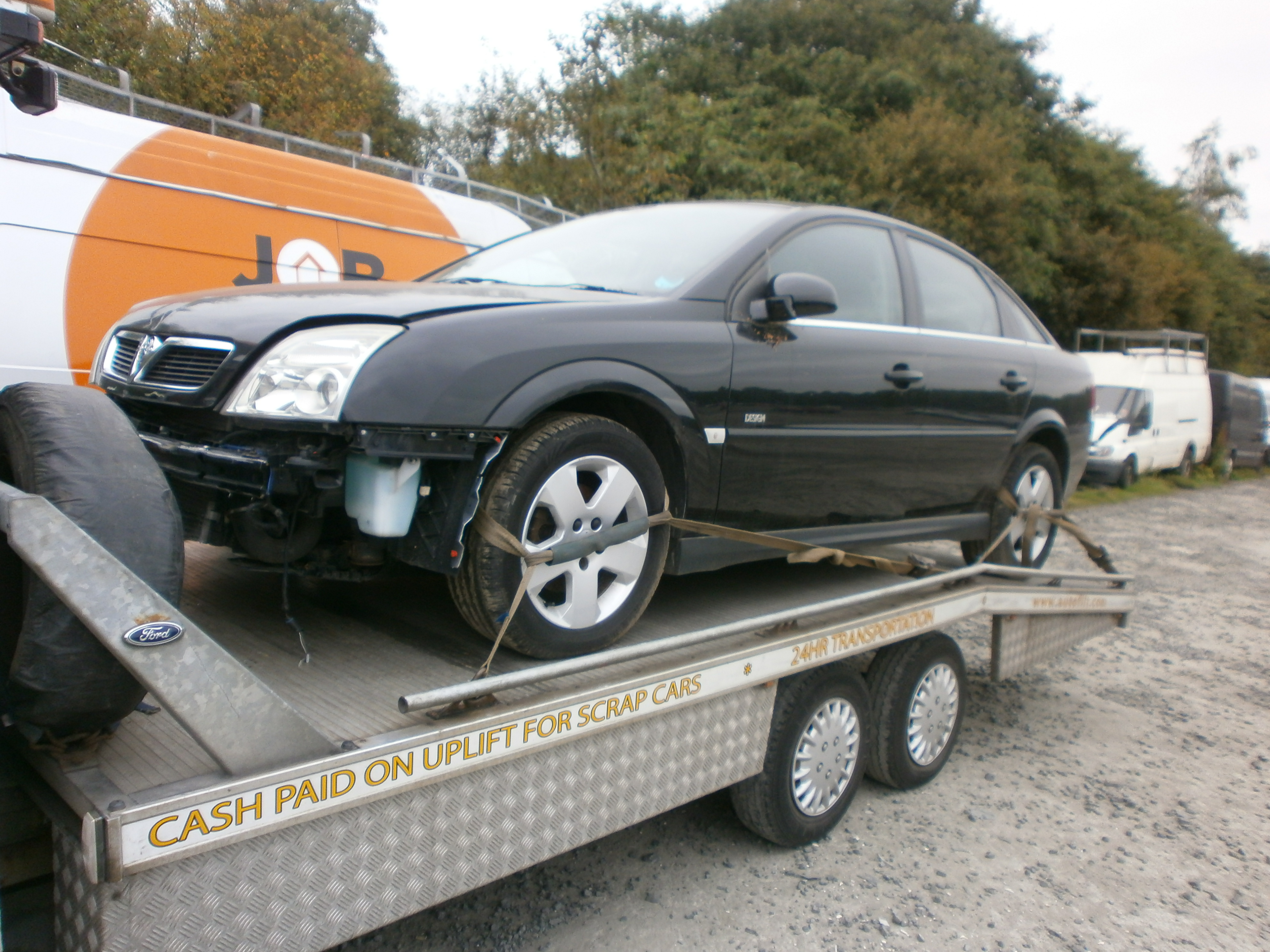 Scrap Vauxhall Astra on the back of the Autoflit transporter